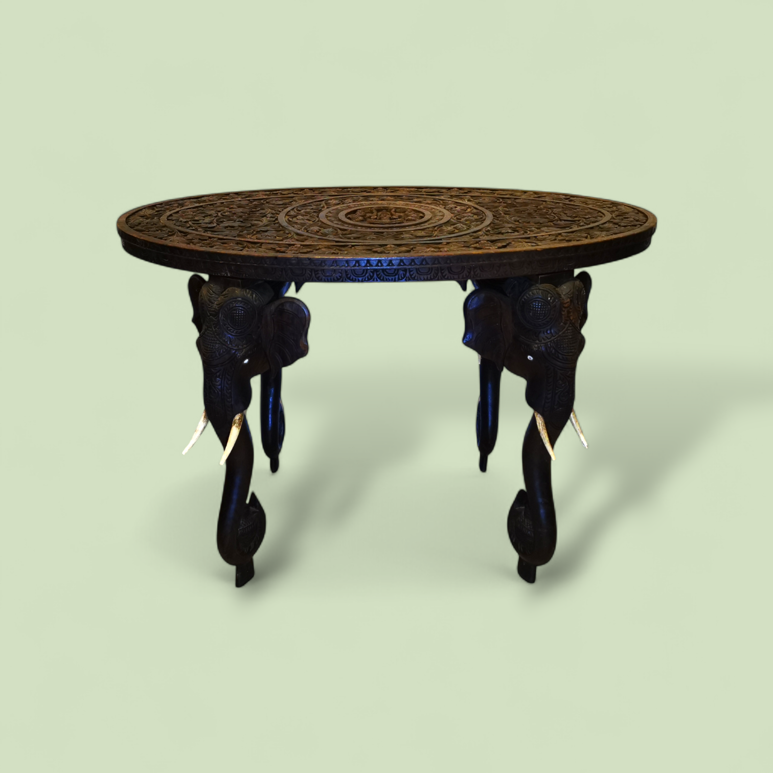 A Large 19th Century Oval Anglo-Indian Carved Hardwood Elephant Table with Solid Bone Tusks