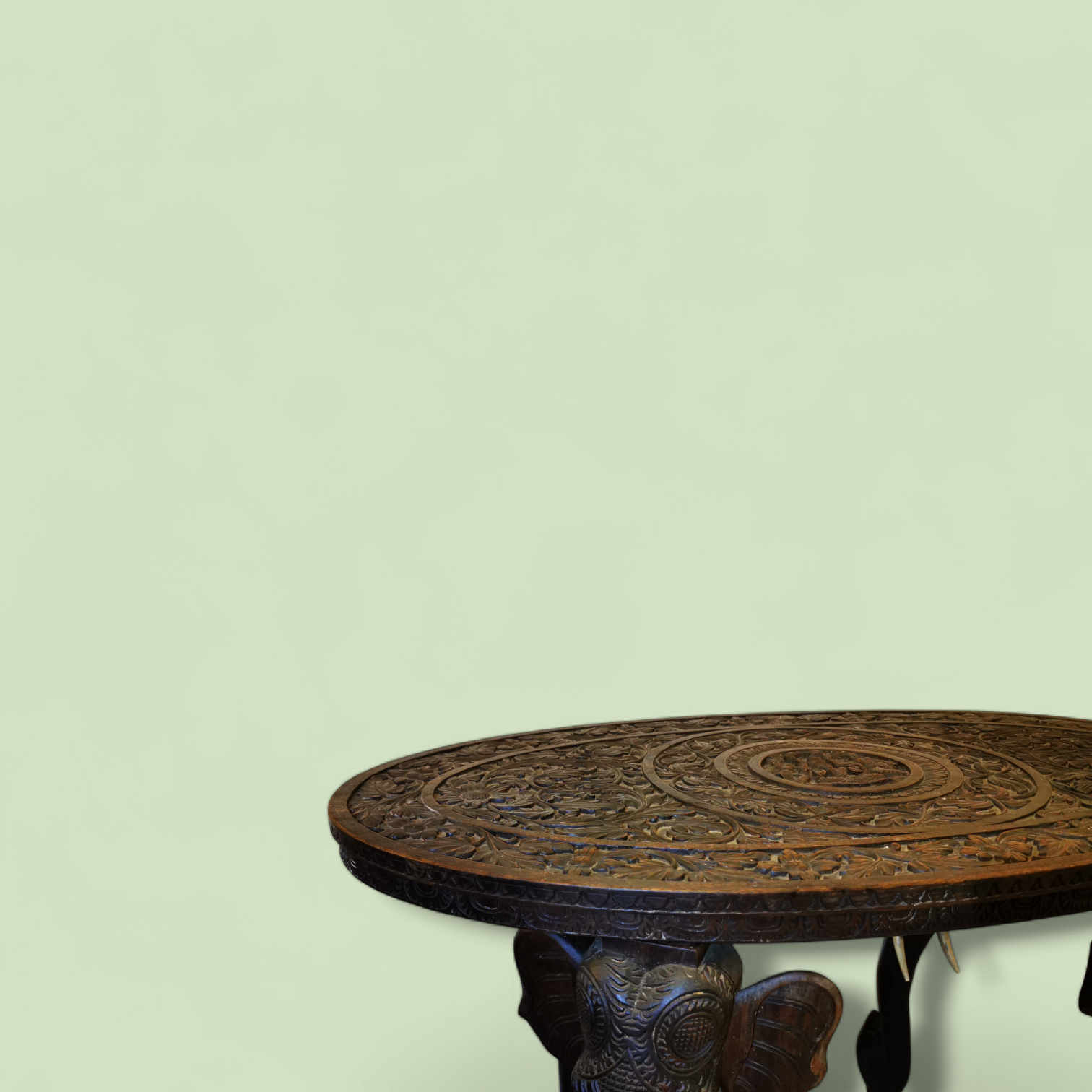 A Large 19th Century Oval Anglo-Indian Carved Hardwood Elephant Table with Solid Bone Tusks