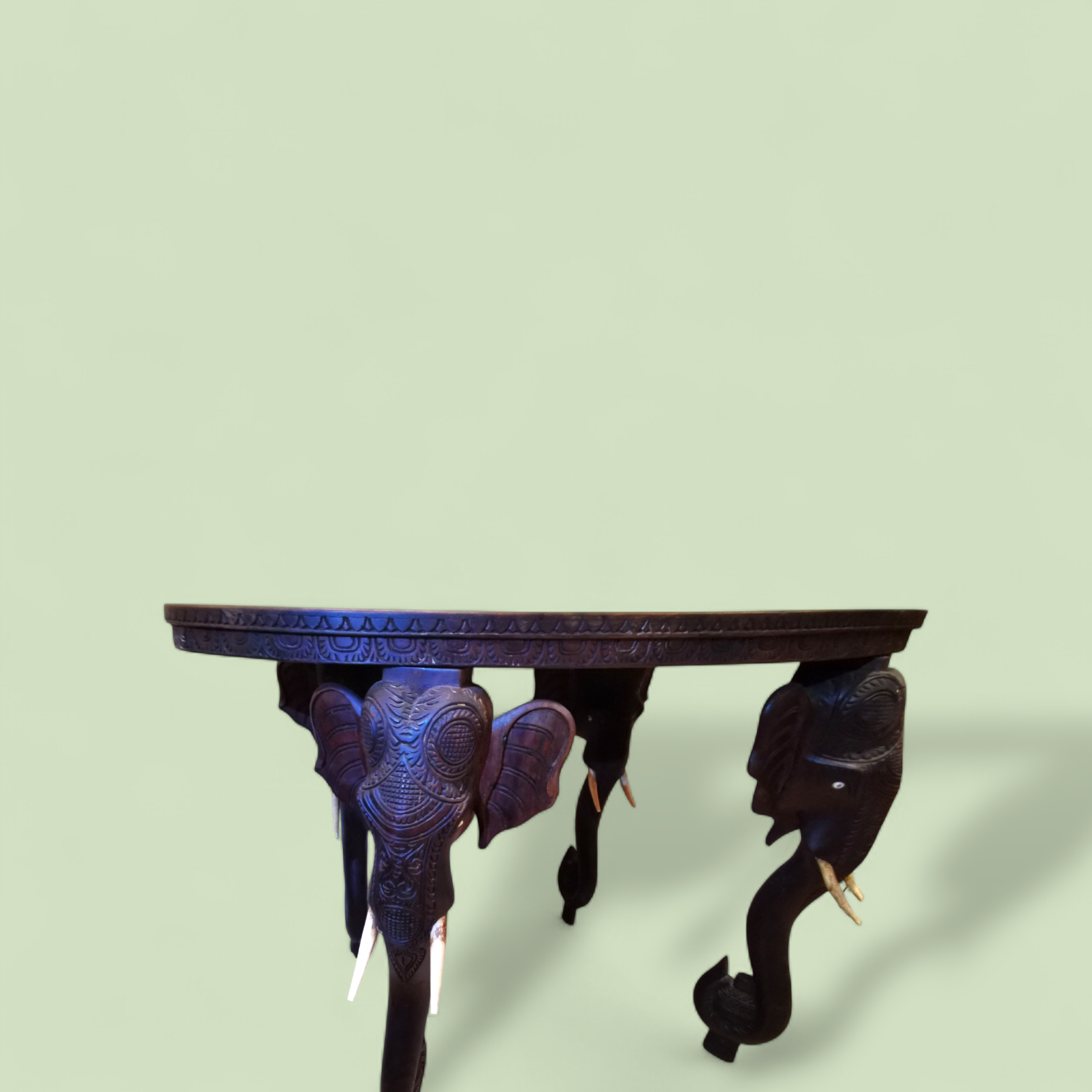 A Large 19th Century Oval Anglo-Indian Carved Hardwood Elephant Table with Solid Bone Tusks